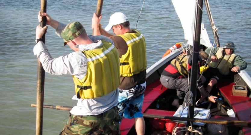 two veterans practice sailing techniques on an outward bound trip